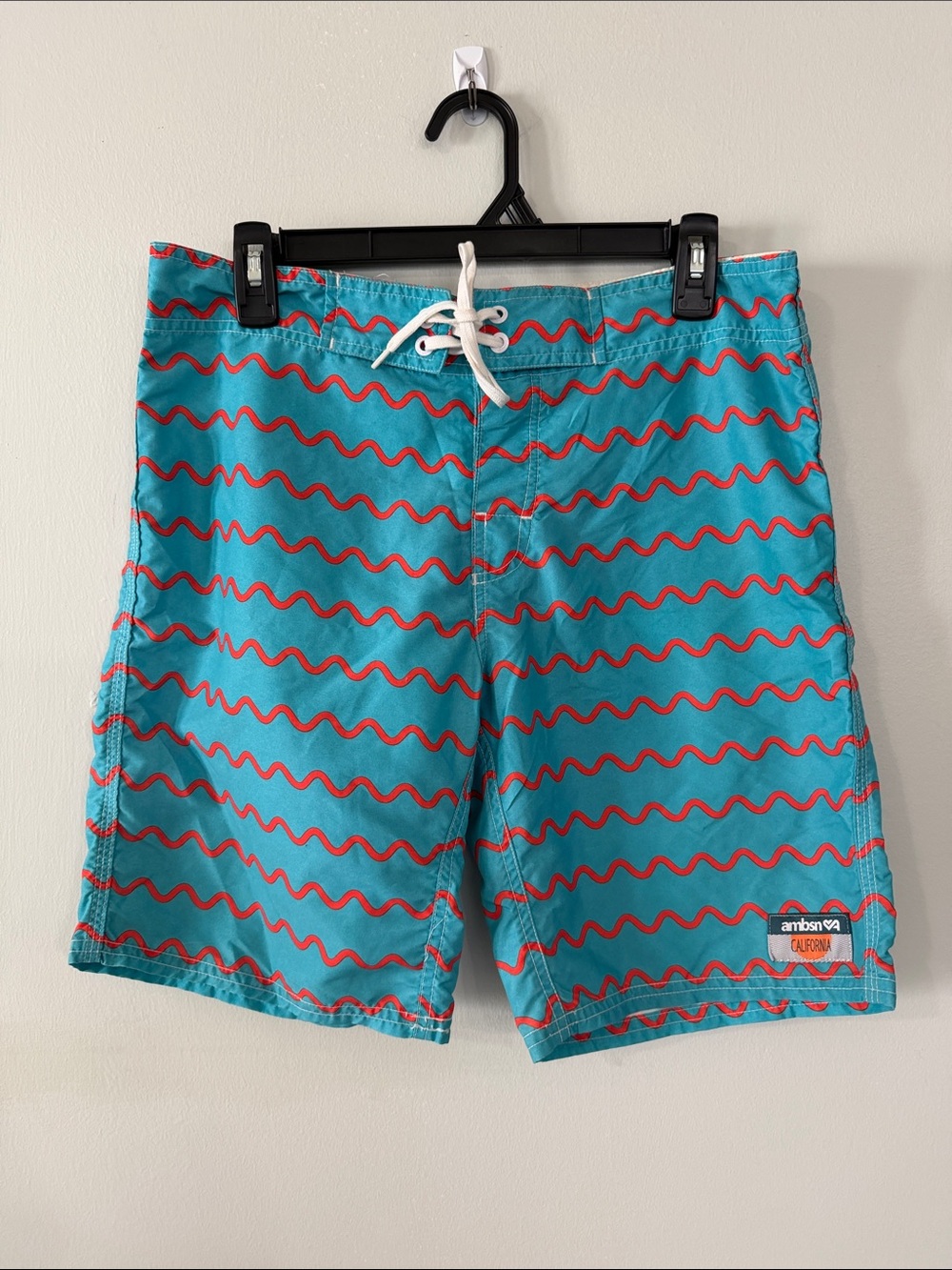 Men's Turquoise Swim Trunks with Red Wave Pattern